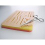 Suture practice pad with mesh